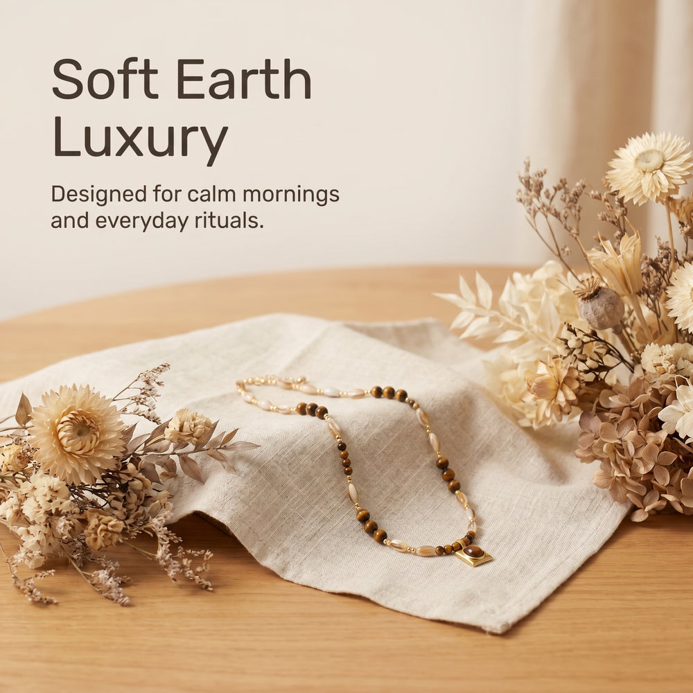 Warm neutral crystal necklace mood image with natural styling