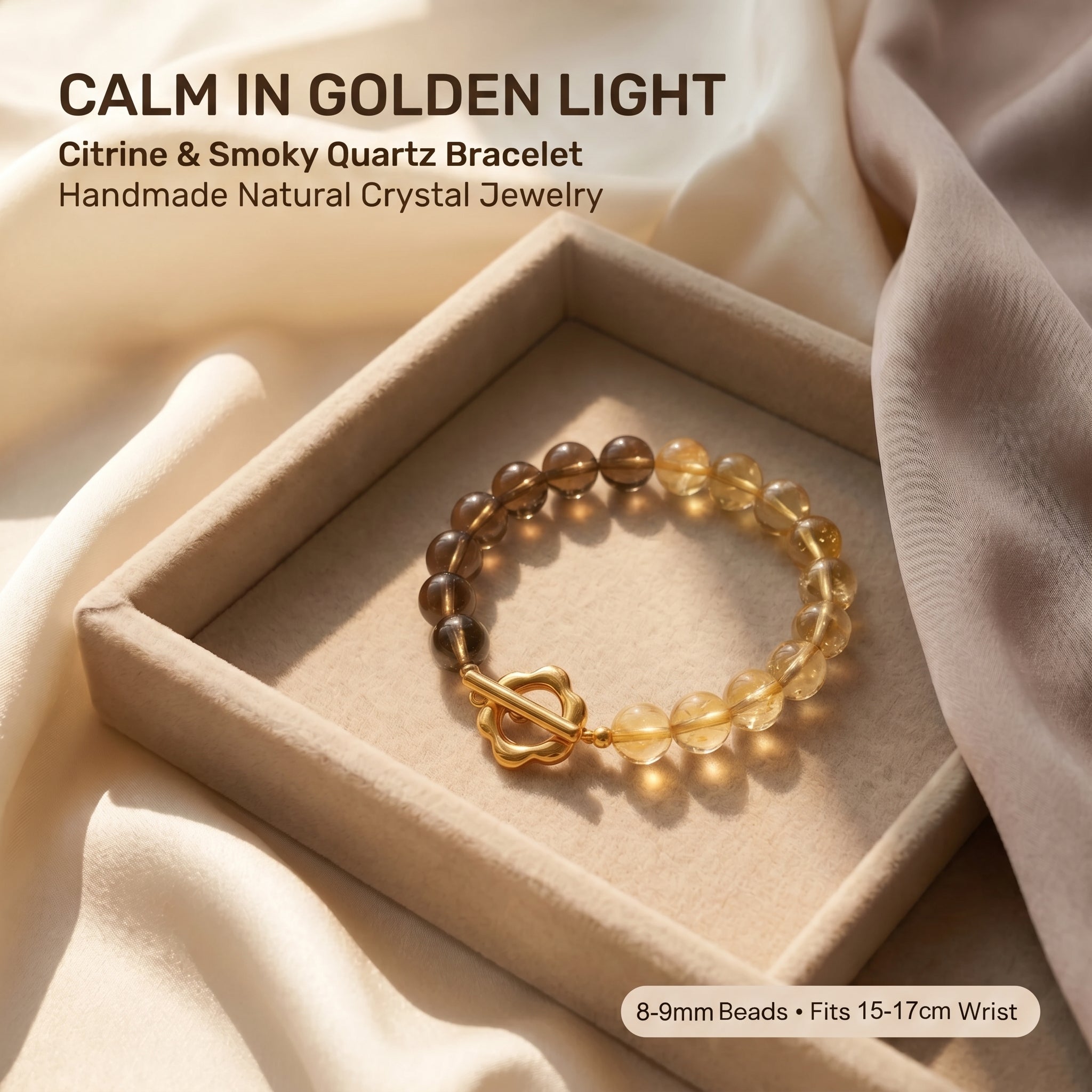 Golden citrine and smoky quartz crystal bracelet with gold clasp on soft neutral fabric background