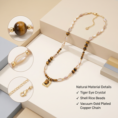 Close up details of tiger eye shell beads and gold plated extension chain