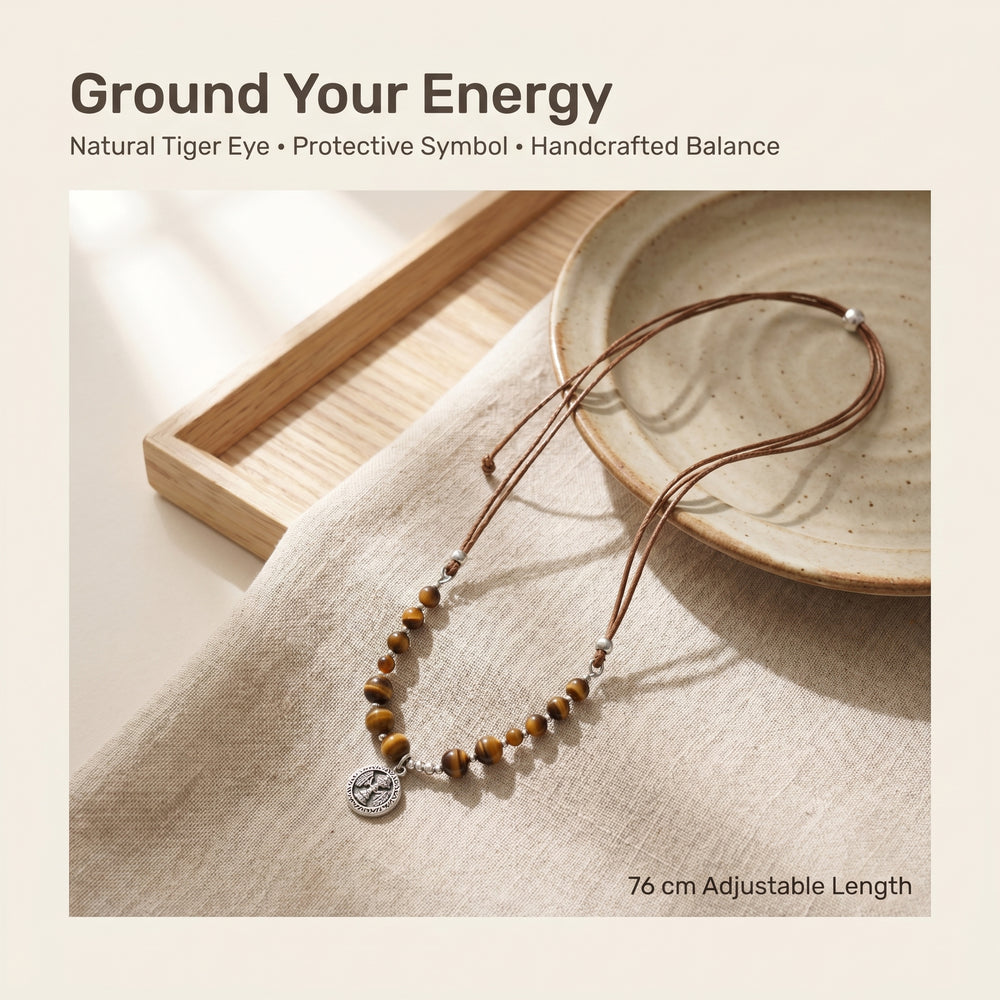 Tiger Eye crystal protection necklace styled in warm neutral lifestyle 